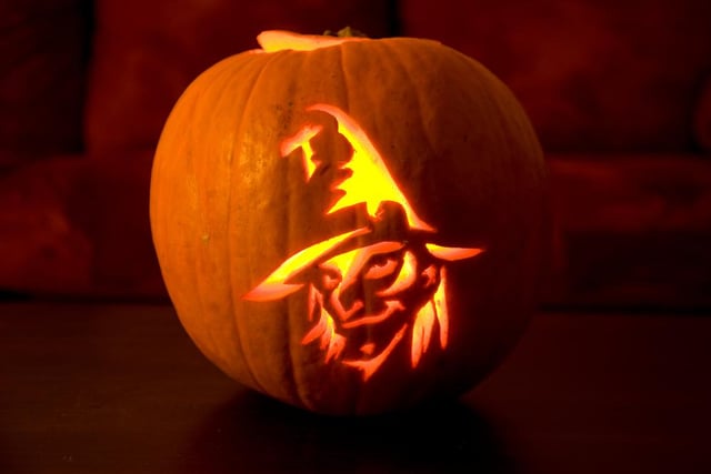 Sometimes less is more when it comes to pumpkin carving, and you can create artistic designs like this witchy looking pumpkin.