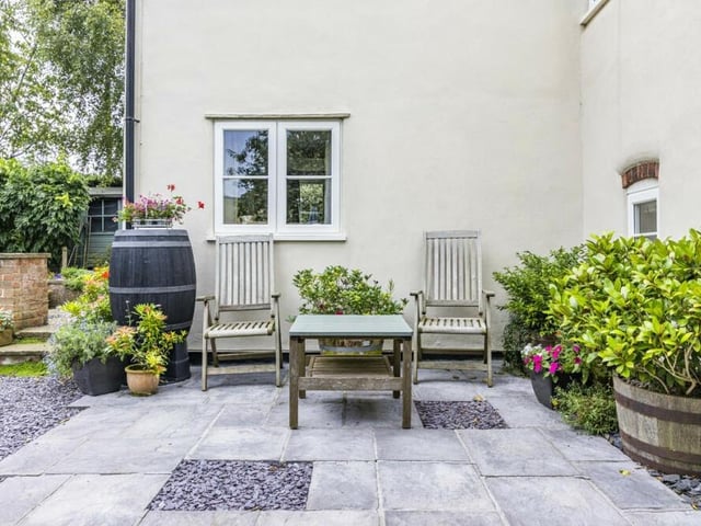 One of numerous, pleasant seating areas within the garden at the £350,000 property.
