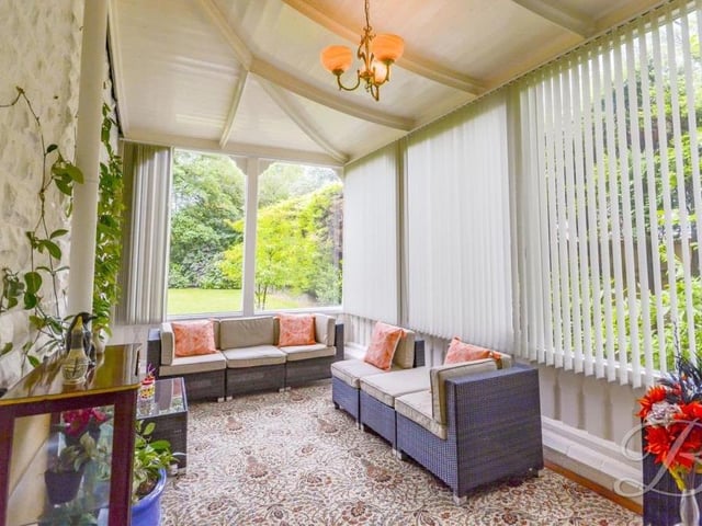 The orangery at the £925,000-plus property looks out on to the magnificent grounds. An exposed brick feature wall gives the room plenty of character, while doors lead both outside and into the hallway.
