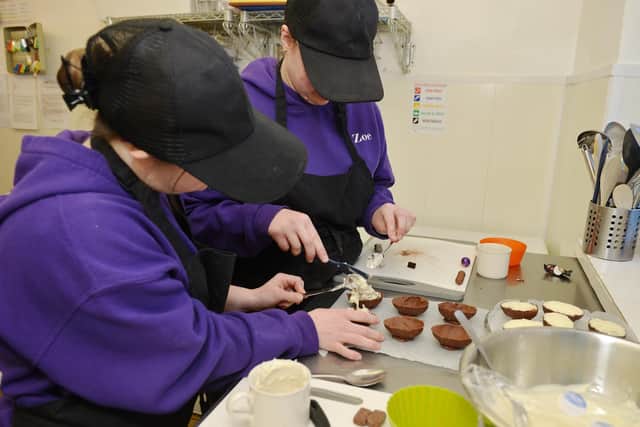 Samâ€™s Workplace, Rainworth are busy making Easter Egg cheesecakes, pictured are Zoe and Jordan