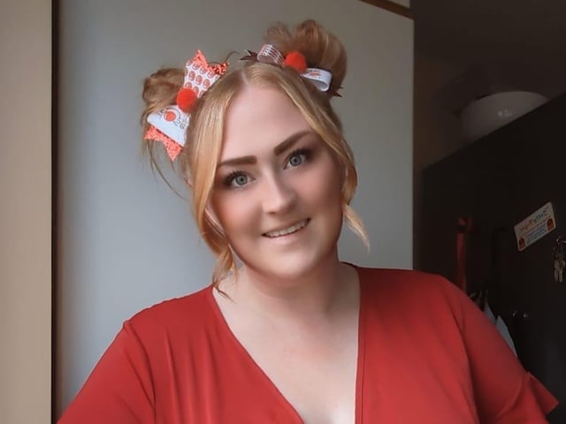 Gemma Leigh Savage dressed up for her job at a school.