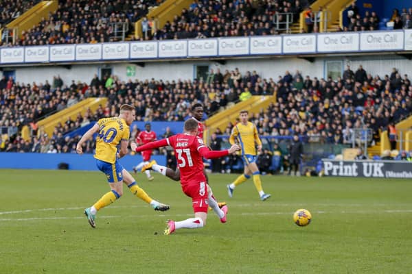 Davis Keillor-Dunn shoots during the Sky Bet League 2 match against Grimsby Town FC at the One Call Stadium, 26 Dec 2023  
Photo credit : Chris & Jeanette Holloway / The Bigger Picture.media