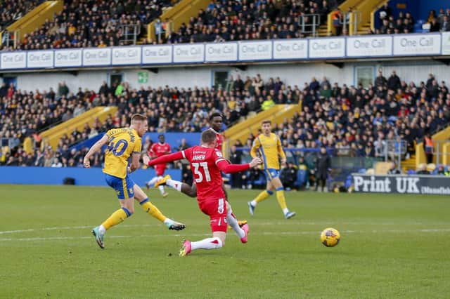 Davis Keillor-Dunn shoots during the Sky Bet League 2 match against Grimsby Town FC at the One Call Stadium, 26 Dec 2023  
Photo credit : Chris & Jeanette Holloway / The Bigger Picture.media