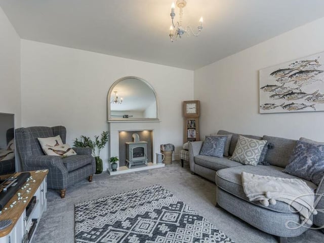 One of the the separate living room's assets is a feature fireplace.