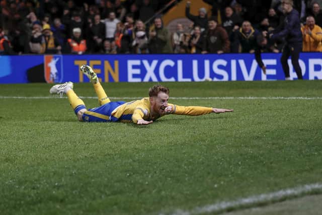 Stags beat Accrington 2-1 to seal a spot in League One next year.