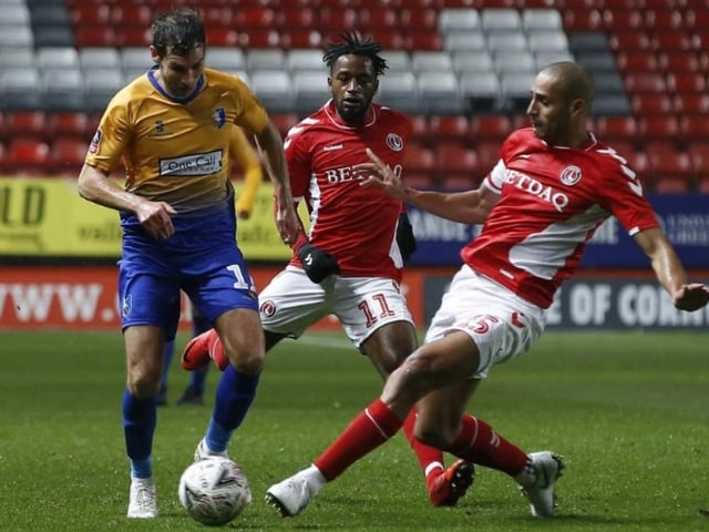 Will Atkinson is tackled by Darren Pratley