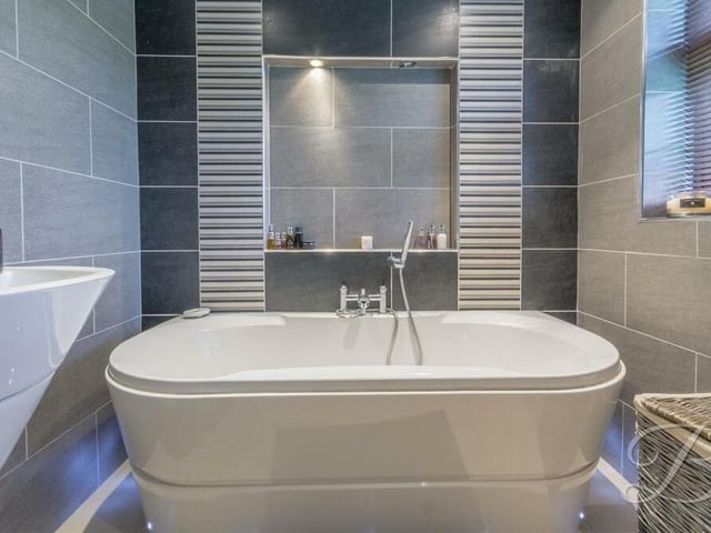 Here is a close-up of the free-standing bath and space for the TV mirror in the family bathroom.