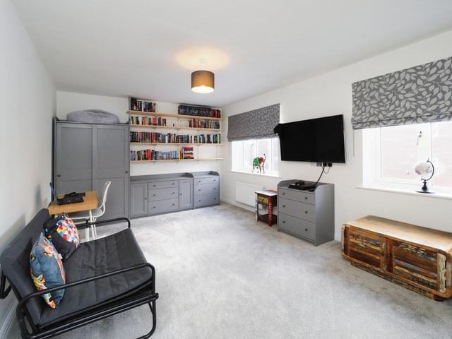 Here is bedroom number two, which has an abundance of space, and also two windows overlooking the front of the Mansfield property.
