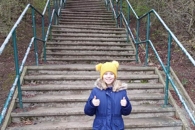 Kind 10-year old Maisey in stair walk fundraiser