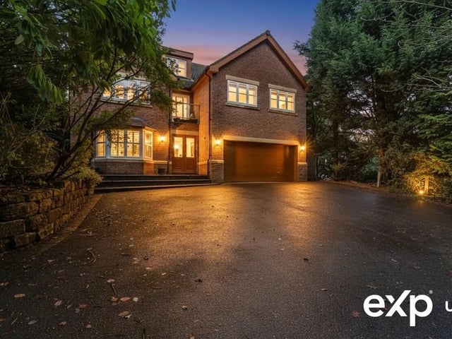 An individually designed and substantial detached executive family home, offering over 4,000 sq ft of versatile accommodation arranged across three beautifully planned storeys. The property boasts multiple light-filled reception rooms, centred around a striking dining kitchen, plus six generous double bedrooms, two dressing rooms, three en-suites, and a luxurious family bathroom. Externally, a secure gated driveway provides ample parking and access to an integral double garage, while the incredibly private and mature garden forms a tranquil sanctuary with a captivating woodland backdrop.