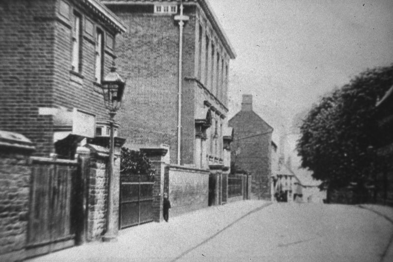 Church Street pictured before it was widened in the 1930s. The fire station, technical college and council offices are seen to the left.