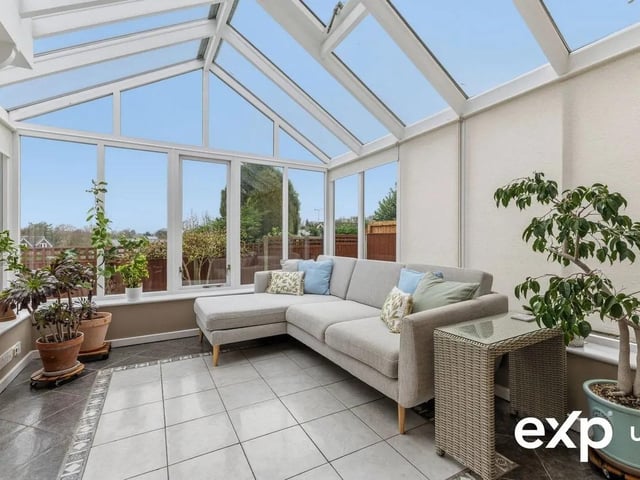This room serves as a tranquil seating nook framing the garden views