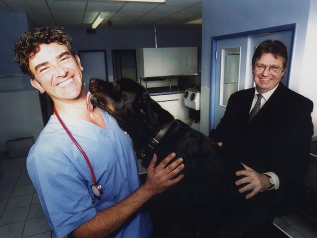 First animal hospital opened in 2000 thanks to Pension fund - Entrepreneur and vet, Peter Eville, treats Baggins the 18month old Rottweiller in Sheffield New Animal Hospital and Andy Bowden, senior management at Lloyds TSB Commercial kept a safe distance.