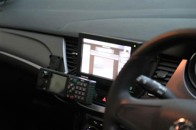 The camera is linked to a computer inside the vehicle.