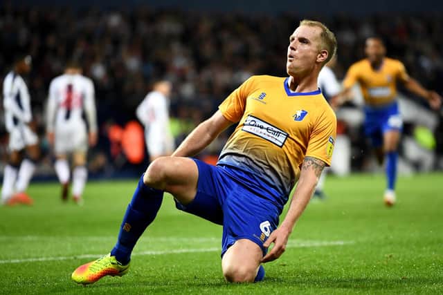 Neal Bishop celebraates scoring for Mansfield Town at West Brom.