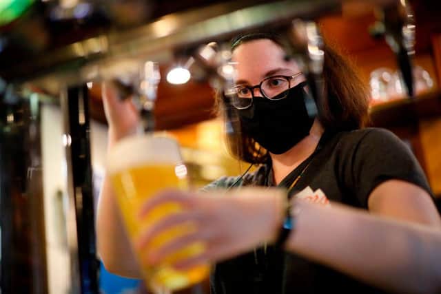 Pubs and restaurants could be allowed to open again for outdoor service only from April (Photo by TOLGA AKMEN/AFP via Getty Images)