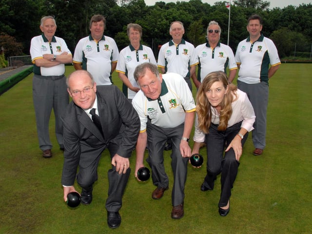 Members of Teversal Grange Bowls Club celebrate after they gained a shirt sponsor. Ken Gregory and Sons Funeral Directors supplied the club with new shirts. Pictured is Club Chairman Harry Johnson, centre, with Gregory Concultants Peter Gregory, left, and Helen Gregory, right, watched by club members.