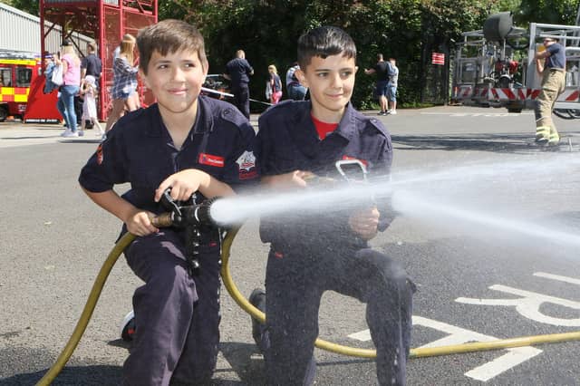 Fire Cadets Josh Clarke and Bentley Mohammed test out the hoses.