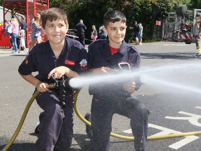 Fire Cadets Josh Clarke and Bentley Mohammed test out the hoses.