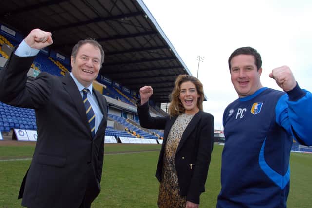Chairman John Radford, Chief Executive Officer Carolyn Radford and boss Paul Cox on their way to guided Stags back into the EFL..