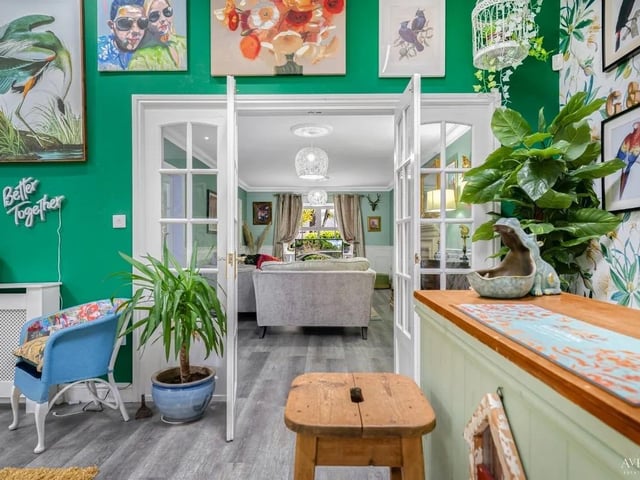 Breath taking entertainment room which resembles a trendy orangery with doors leading out onto the garden