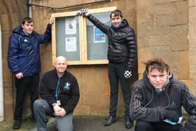 Thomas Bates, Simon Dosanjh, Nathan Buckingham and Ethan Poole with the new noticeboard they made for Holy Trinity Church in Shirebrook.