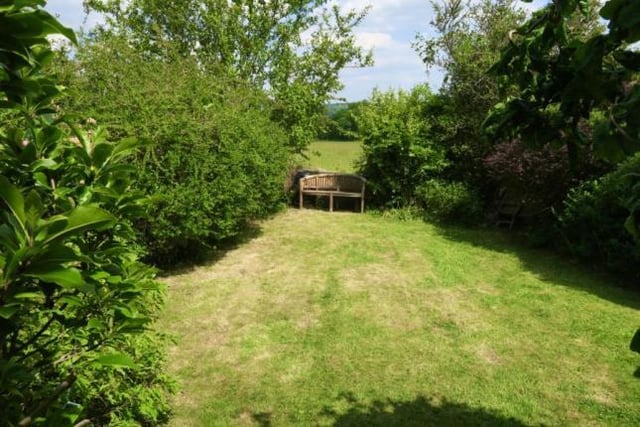 The back garden features an elevated patio seating area, flower bed boarders and a large lawn. There is also a 'secret' garden overlooking the meadows and countryside.