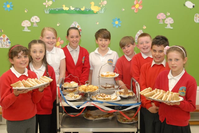 Year 5 children from Harton Primary were holding a tea party for local residents seven years ago. Can you spot anyone you know in the photos?
