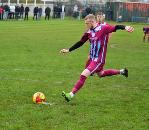 Ben Owen Charlesworth steps up to score from the spot for Shirebrook Soldiers.