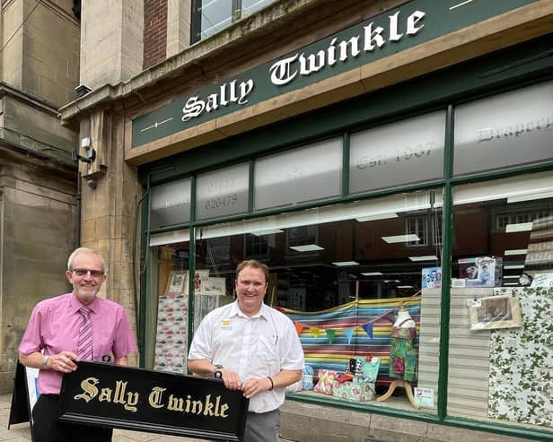 Sally Twinkle saved -David Marriott is pictured handing over the Sally Twinkle sign to Duncan Adams. The actual sign is still the original that Margaret Elliot had installed when she founded the business.