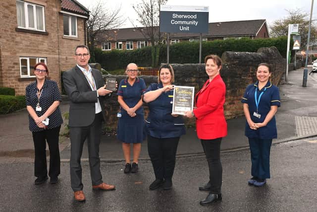 Chief nurse Phil Bolton and trust chair Claire Ward (in red) with the Sherwood Community Unit team.