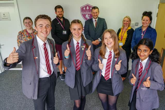 Students Cameron Jackson, Sienna Hayward, Jess Harrison and Dhanushiya Asaithambi are pictured with teaching staff Danielle Bartley, head of year 7-history teacher, Dave Gray, head of PE department, James Aldred, headteacher, Rebecca Moors, deputy head, and Albany Bleasdale, head of personal development.