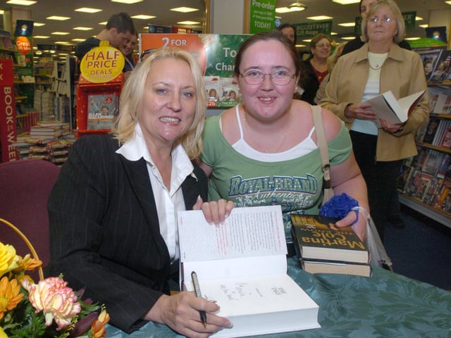 Pictured at W H Smiths, Meadowhall, where writer Martina Cole was seen signing copies of her book The Take. With her is fan Maria Oflaherty from Wincobank, Sheffield.