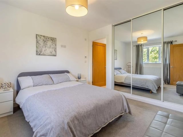 One of four double bedrooms in the spacious property with fitted wardrobes for extra storage.