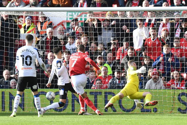 Lewis Grabban, centre, scores for Nottingham Forest in the East Midlands derby match against Derby County on January 22, 2022.