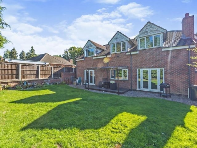 The view from the back of the Mansfield Road property makes for quite an imposing sight. Size and space are the key words.