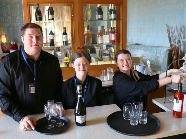 Left to right - Bobby Cheney, Amy Smith and Leah Wood serving drinks in the hotel's Brasserie bar