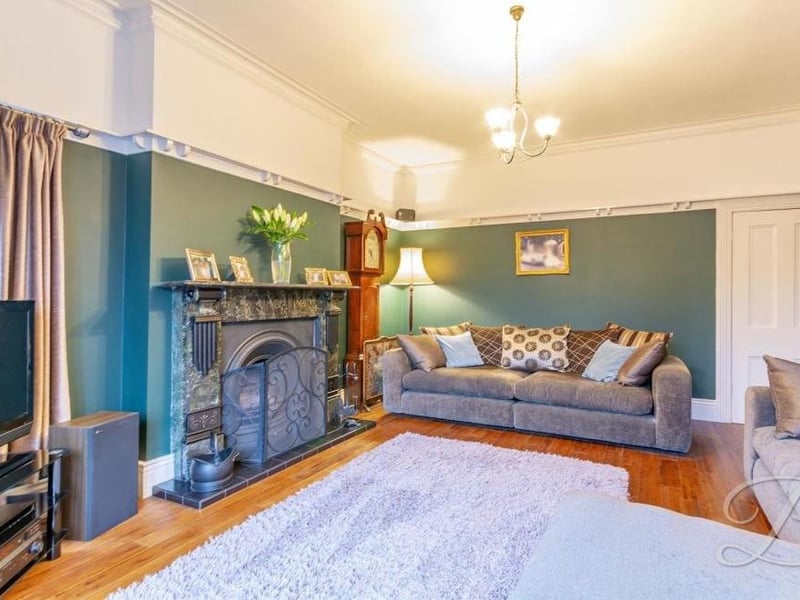 A second shot of the living room at the Alexandra Avenue house. Although it is a sizeable space, it remains warm and cosy thanks to its beautiful working marble fireplace,.