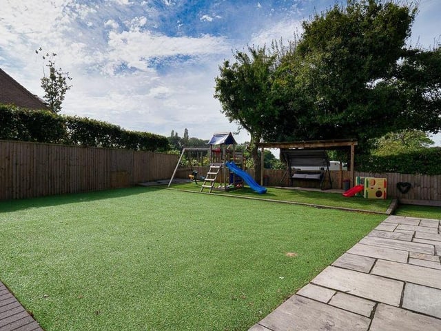 As well as the patio and a gravelled entertaining space by the kitchen, the sizeable garden includes Astroturf areas on all three sides of the plot.