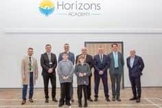 L-R Coun Rory Green, Trust CEO David Cotton, Principal Lee Beesley, Council Leader Mick Barton, Coun Simon Green, Coun James Walker-Gurley and Dan Maher (Arc) Front row is Curtis Goddard (in Year 8) and Isobel Chadwin (Year 6)