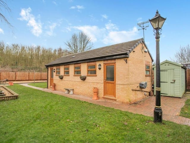 At the far end of the rear garden sits this sturdy, brick and tile 330 square foot outbuilding. It is currently being utilised as dog kennels but could be altered to suit a variety of uses.There are five kennels, plus storage space and a sink with water supply, and about half of the building is covered by underfloor heating.