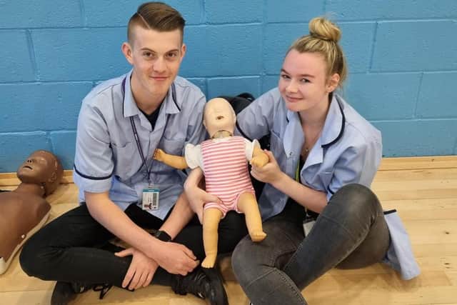 Health and social care students Freddie Diver and Bree Jenkinson were able to practice child CPR