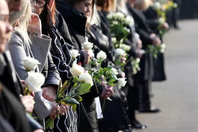 Local consultants and managers lined the route, holding white roses and spring daffodils, which were thrown into the path of the hearse.