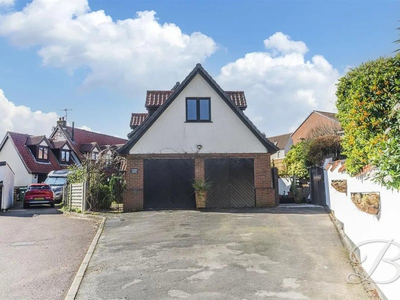 To the front elevation, a driveway provides off-street parking for up to six vehicles.