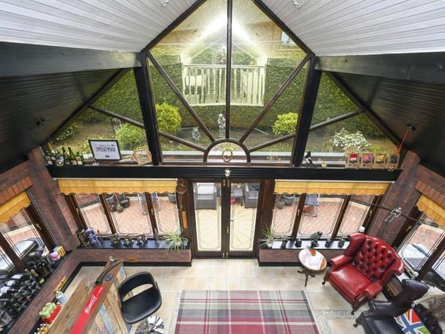 This shot from on high gives a real insight into the unique design of The Arches. It is a view from the second-floor open mezzanine landing/lounge overlooking the brick-built conservatory/bar, which has a feature vaulted ceiling and tiled flooring.