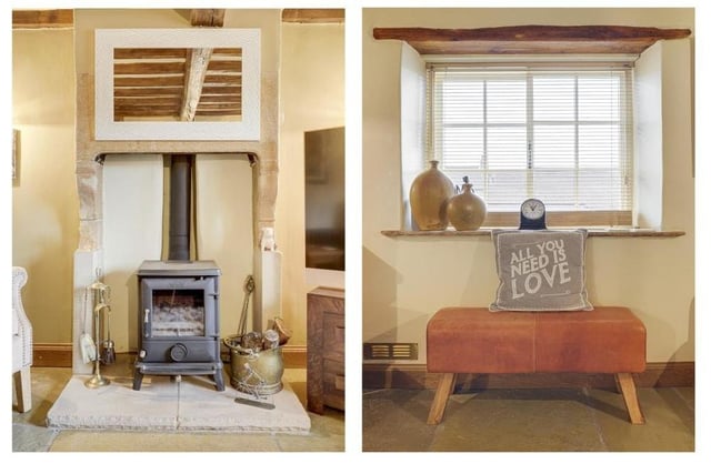 Two pleasant features that capture the essence of the living room at the £375,000 Linby cottage -- its fireplace and its sash window.