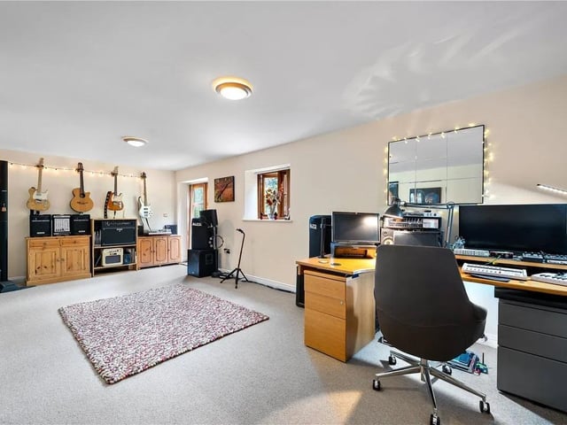 This spacious area can be used as a fifth bedroom or an additional reception room.