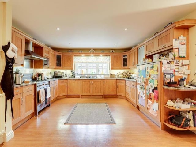 The spacious, classy kitchen includes a whole host of integrated appliances, including a microwave, fridge, freezer and dishwasher, not to mention a free-standing range cooker with a gas hob. A range of fitted base and wall units, with Granite worktops and under-cabinet lighting, adds to the room's appeal.