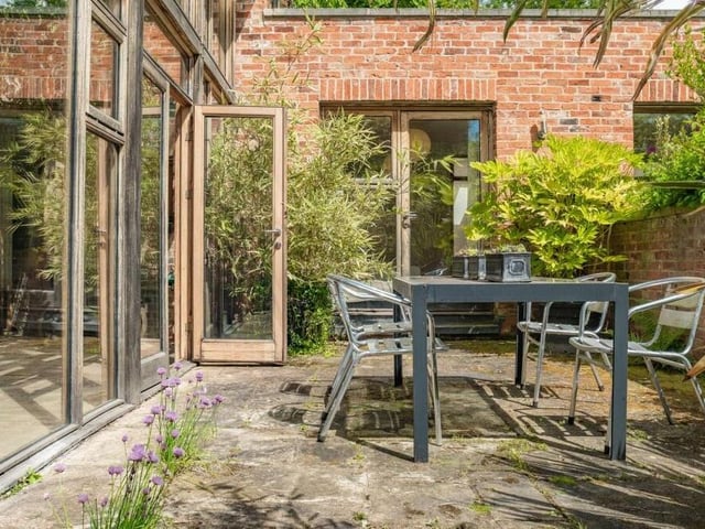 Tranquillity can be enjoyed throughout the property and its grounds, including in this peaceful, relaxing corner, which is accessed from the garden room and one of the bedrooms.