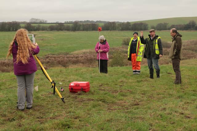 Members of the Battle of Hatfield Investigation Society undertaking a topographical survey on land near Cuckney St Mary's Church.